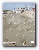 Looking at the rightmost row of piles, our house starts at the first pile past the missing one.