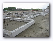 Ours is now easy to recognise - we're the only ones that wanted the foundations for the addition without the addition itself - so we're the only ones with a foundation in place as well as a separate cross bar for the back wall (fourth house from the front)
