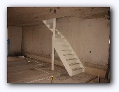 The stairs going up from the ground floor