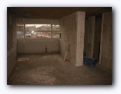 A different house - with some walls & floors in place - kitchen area