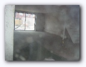 Everything is closed - photography through very dirty windows.  But the floor is done!  Peering in the kitchen window