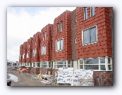 Looks pretty good.  Think they're planning interior walls soon - the packages in the foreground are wall sections.